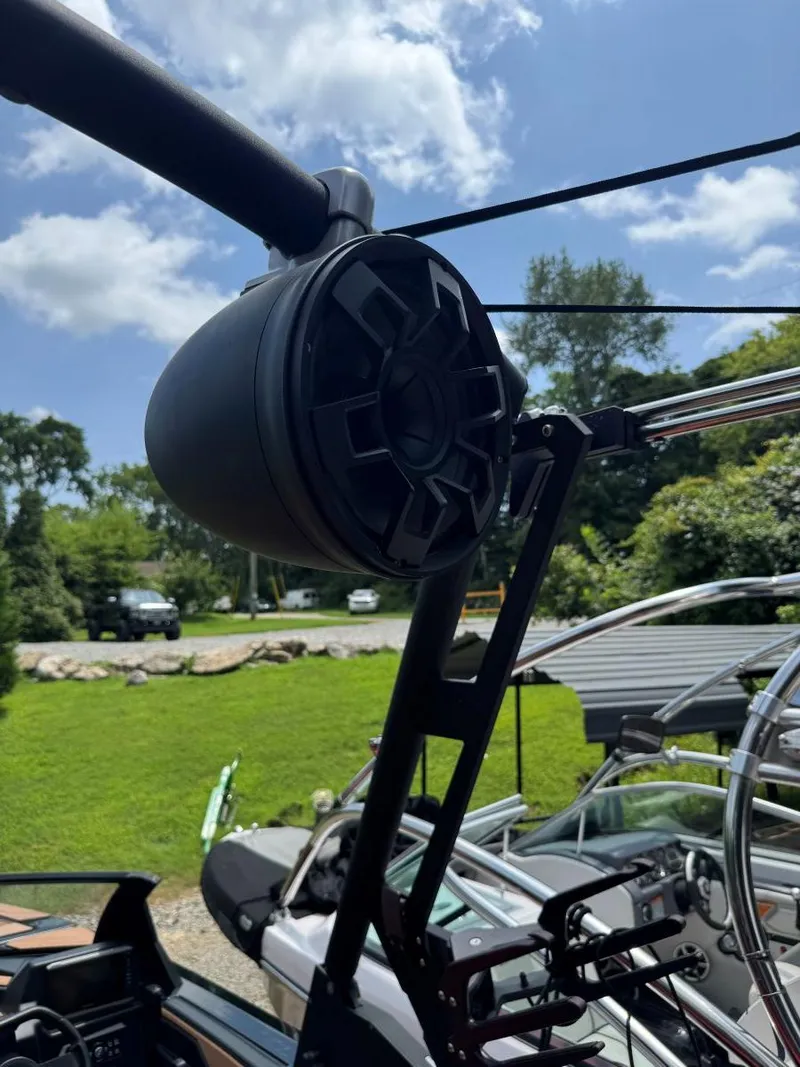 Slide: The Image of 2022 Axis T250 boat speaker system with clear sky and greenery background. - 37