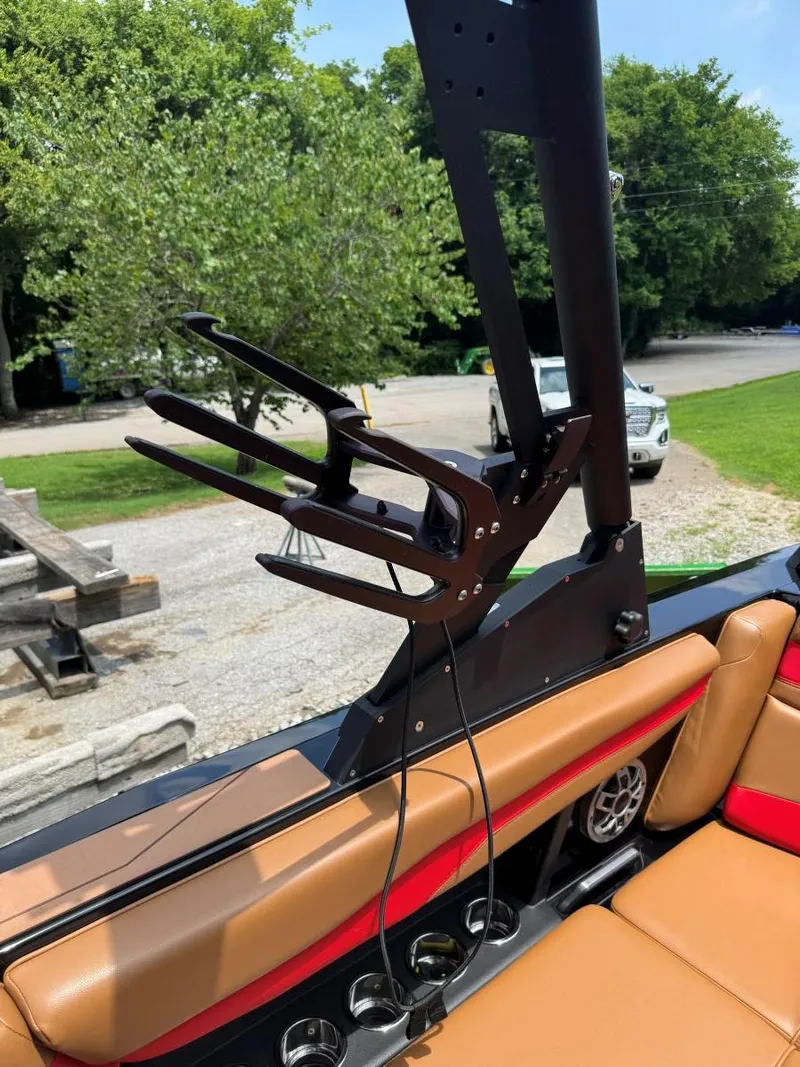 Slide: The Image of Axis T250 boat interior with wakeboard rack, tan seats, and cup holders, 2022 model. - 39