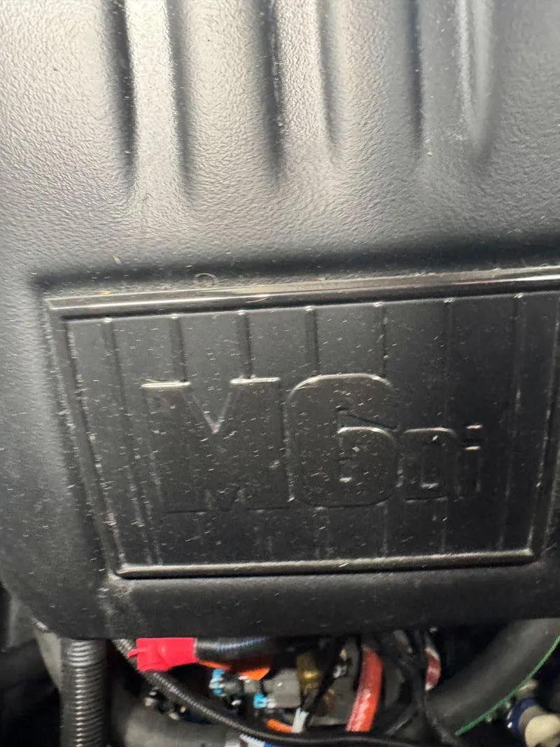 Slide: The Image of Axis T250 2022 engine cover with M6di branding, showcasing vehicle's engine details. - 44