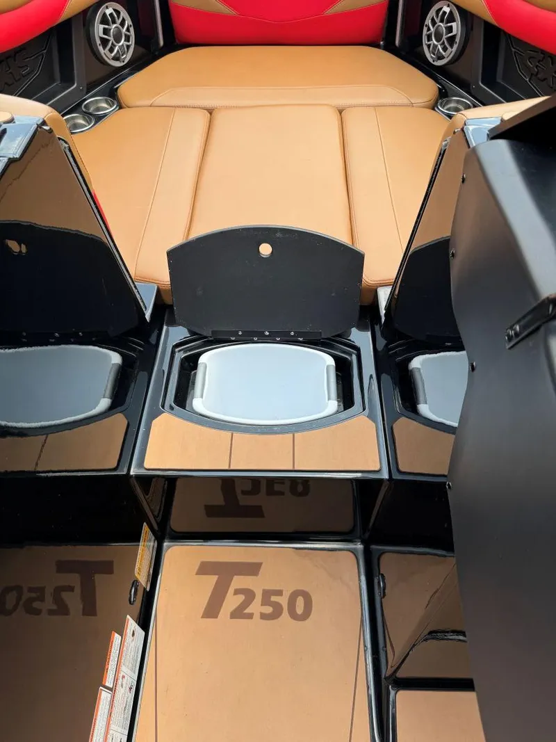 Slide: The Image of 2022 Axis T250 boat interior with tan seats and storage compartments. - 46
