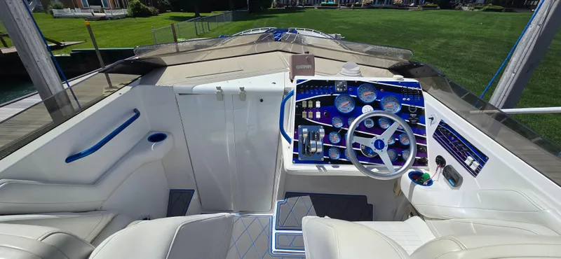 Slide: The Image of Cockpit of 2007 Fountain 42 Executioner boat with modern controls and steering wheel. - 10