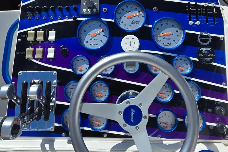 Slide: The Image of Dashboard of a 2007 Fountain 42 Executioner boat with gauges and controls. - 11