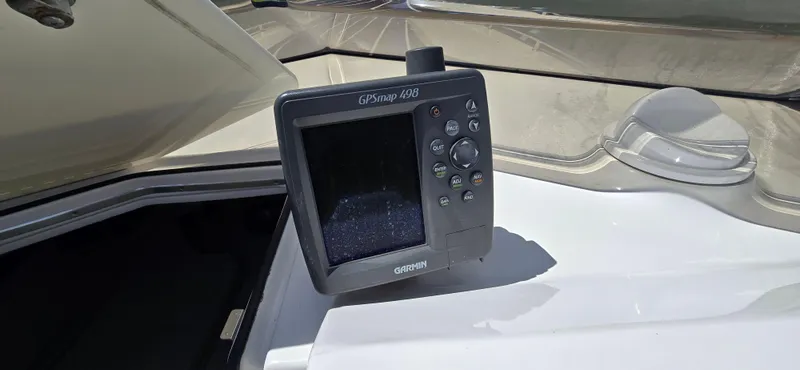 Slide: The Image of Garmin GPSmap 498 on 2007 Fountain 42 Executioner boat dashboard. - 13