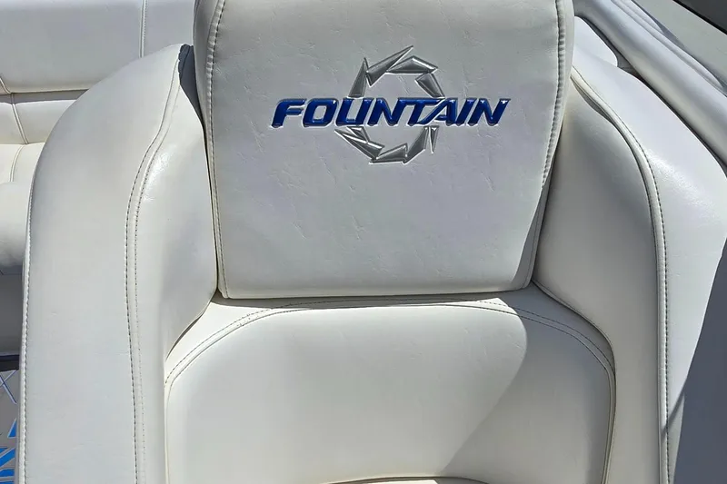 Slide: The Image of White leather seat with "Fountain" logo, 2007 Fountain 42 Executioner boat. - 16