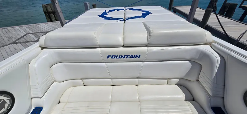 Slide: The Image of 2007 Fountain 42 Executioner boat with white leather seating at a dock. - 18