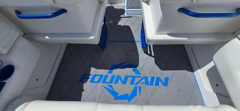 Slide: The Image of Interior of a 2007 Fountain 42 Executioner boat with blue accents and logo. - 19