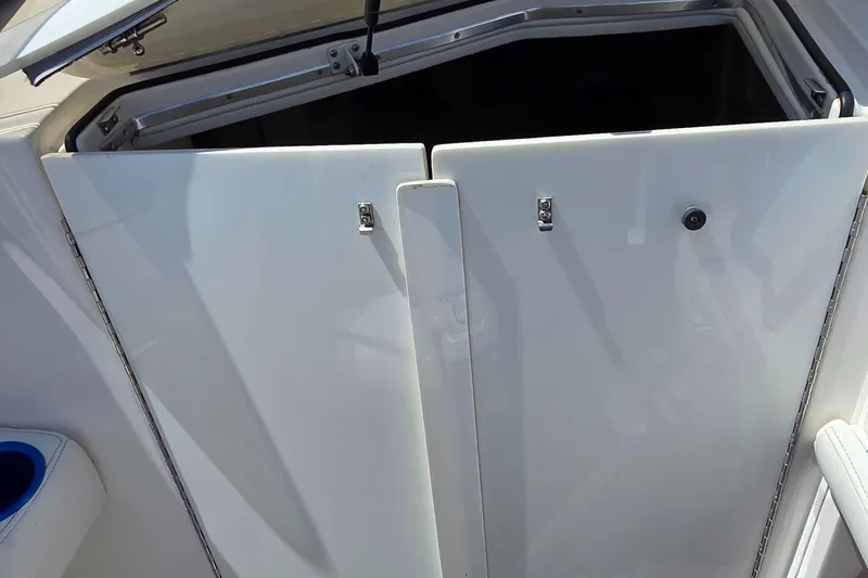 Slide: The Image of 2007 Fountain 42 Executioner boat cabin entrance with open hatch and white doors. - 20