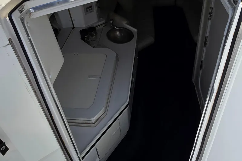 Slide: The Image of Interior view of 2007 Fountain 42 Executioner boat cabin with kitchenette and sink. - 21