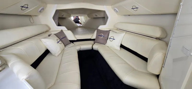 Slide: The Image of Luxurious interior of a 2007 Fountain 42 Executioner boat with plush seating and branded cushions. - 22