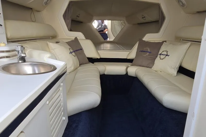 Slide: The Image of Interior of 2007 Fountain 42 Executioner boat with plush seating and compact sink. - 23
