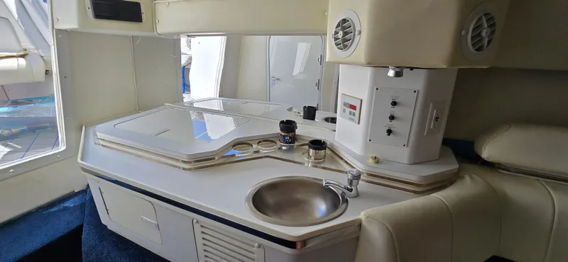 Slide: The Image of Interior of 2007 Fountain 42 Executioner boat with kitchenette and sink. - 25