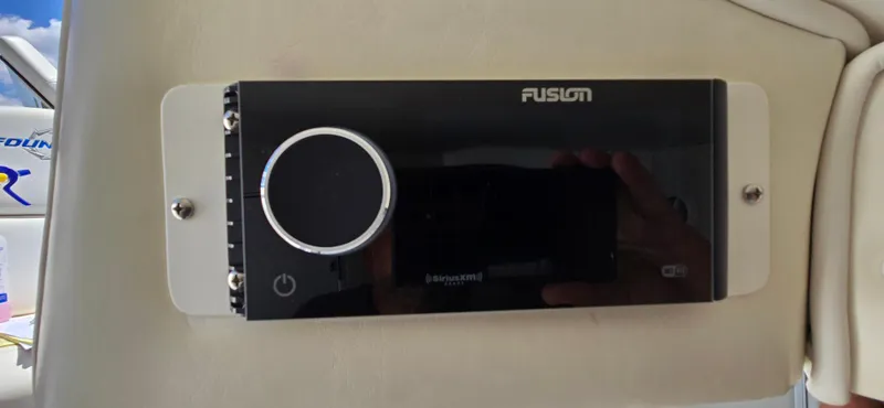 Slide: The Image of Fusion audio system on 2007 Fountain 42 Executioner boat dashboard. - 30