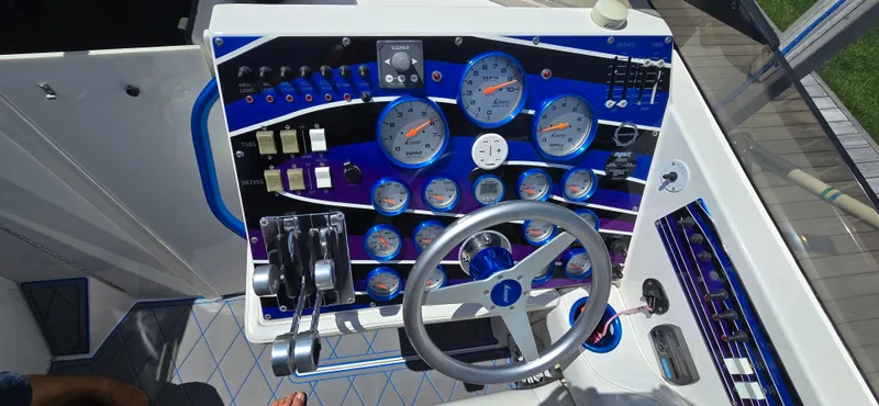 Slide: The Image of Dashboard of a 2007 Fountain 42 Executioner boat with gauges and controls. - 9