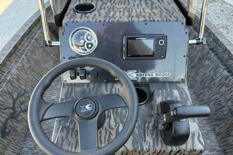 Slide: The Image of Steering console of 2026 Xpress H210B boat with digital display and controls. - 10