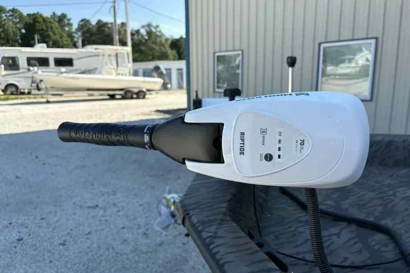 Slide: The Image of Trolling motor on Xpress H210B boat, 2026 model, in outdoor setting. - 12