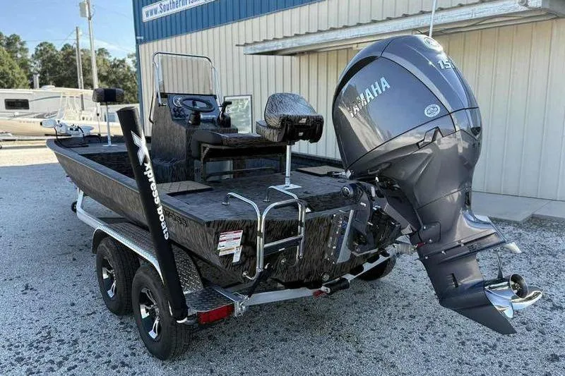 Slide: The Image of 2026 Xpress H210B boat with Yamaha 150 engine on trailer. - 5