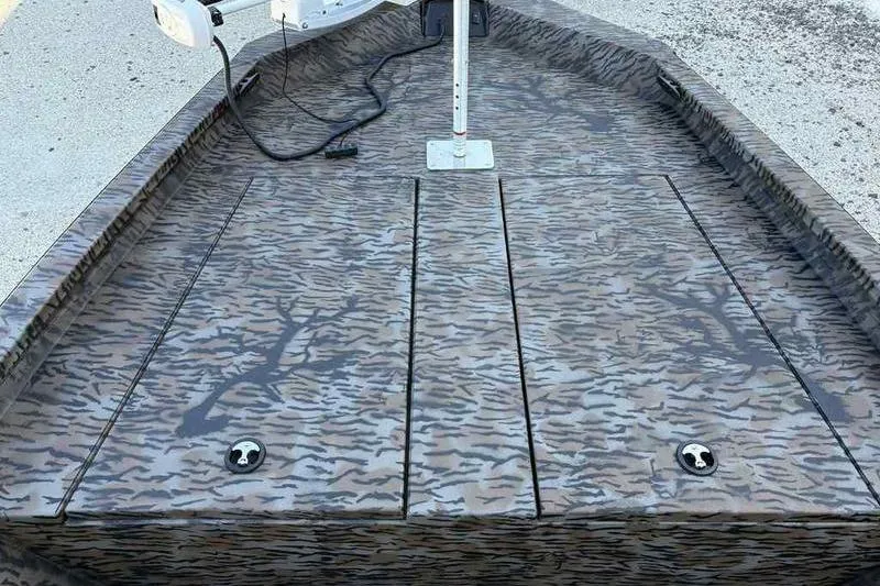 Slide: The Image of 2026 Xpress H210B boat deck with camouflage pattern and mounted equipment. - 9