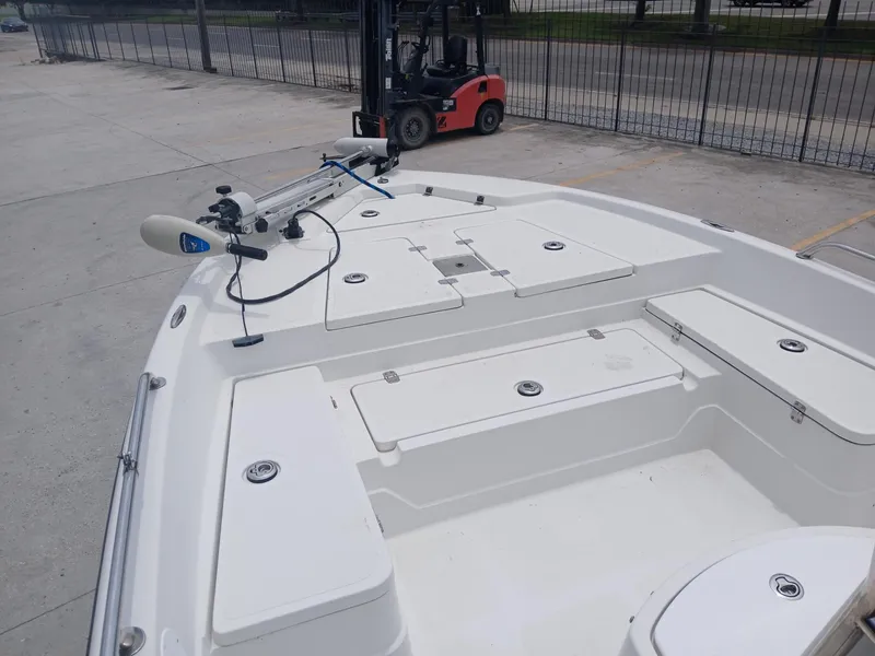 Slide: The Image of 2005 Skeeter ZX 2200 boat deck with storage compartments and trolling motor. - 9