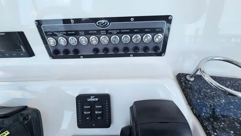 Slide: The Image of Control panel of 2022 Sea Fox 249 Avenger boat with switches and Lenco trim tab controls. - 13