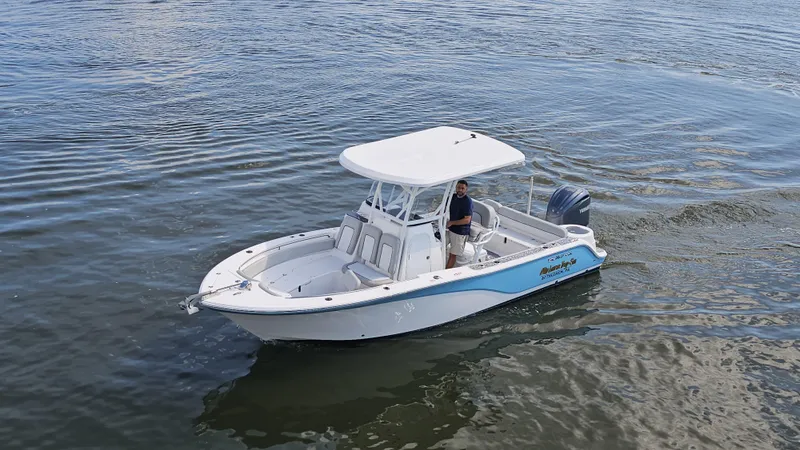 Slide: The Image of 2022 Sea Fox 249 Avenger boat cruising on calm water. - 5