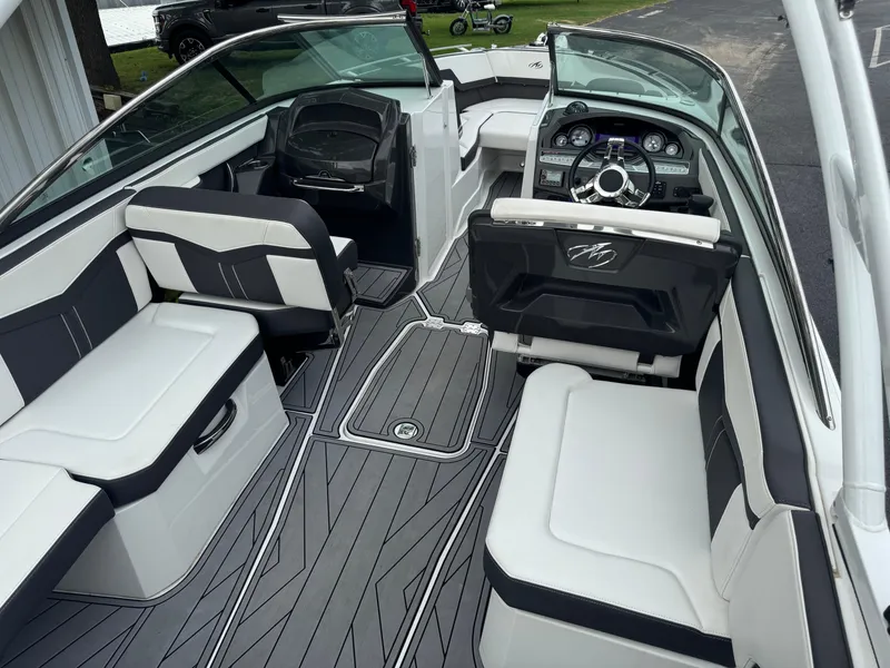 Slide: The Image of 2022 Monterey 278SS Super Sport boat interior with sleek seating and modern dashboard. - 18
