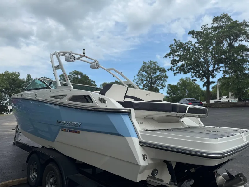 Slide: The Image of 2022 Monterey 278SS Super Sport boat on trailer, parked outdoors under cloudy sky. - 3