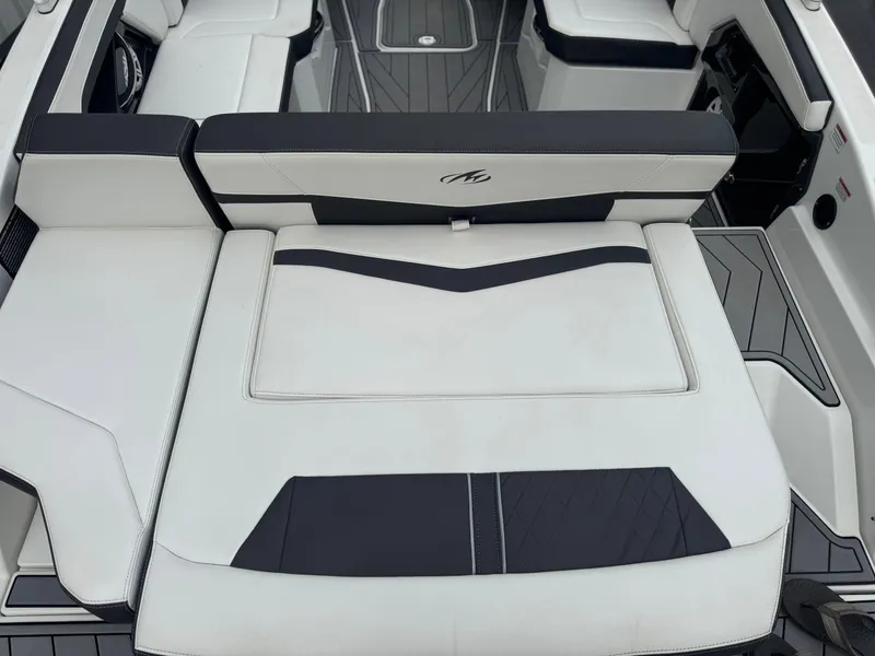 Slide: The Image of 2022 Monterey 278SS Super Sport boat interior with sleek white and black seating. - 6