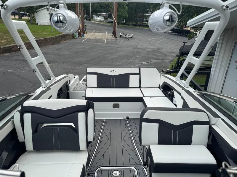 Slide: The Image of 2022 Monterey 278SS Super Sport boat interior with sleek black and white seating. - 7