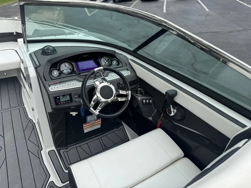 Slide: The Image of 2022 Monterey 278SS Super Sport boat interior with steering wheel and dashboard controls. - 9