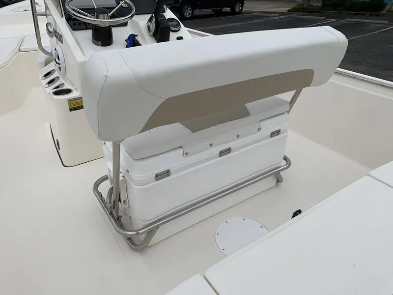 Slide: The Image of 2026 Bulls Bay 2000 boat interior with helm, seat, and cooler. - 11