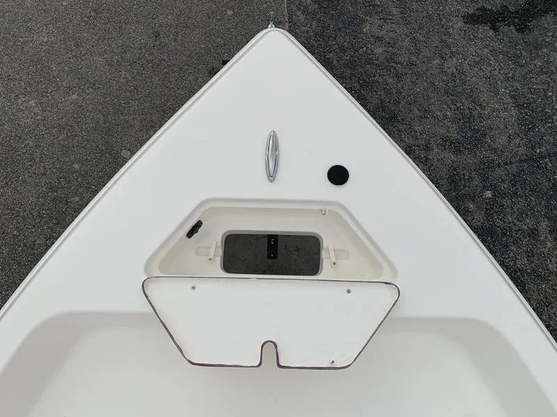 Slide: The Image of 2026 Bulls Bay 2000 boat interior with white seating and storage compartments. - 20