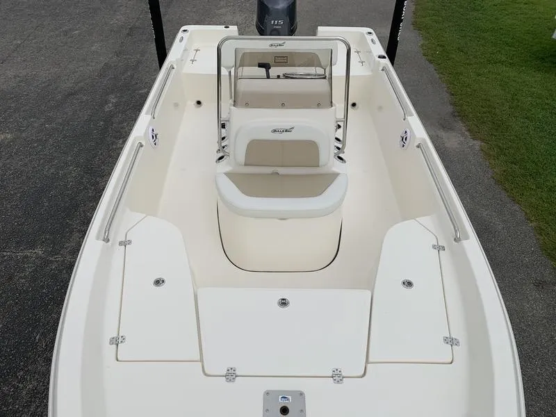 Slide: The Image of 2026 Bulls Bay 2000 boat interior with open storage compartment and cushioned seating. - 23