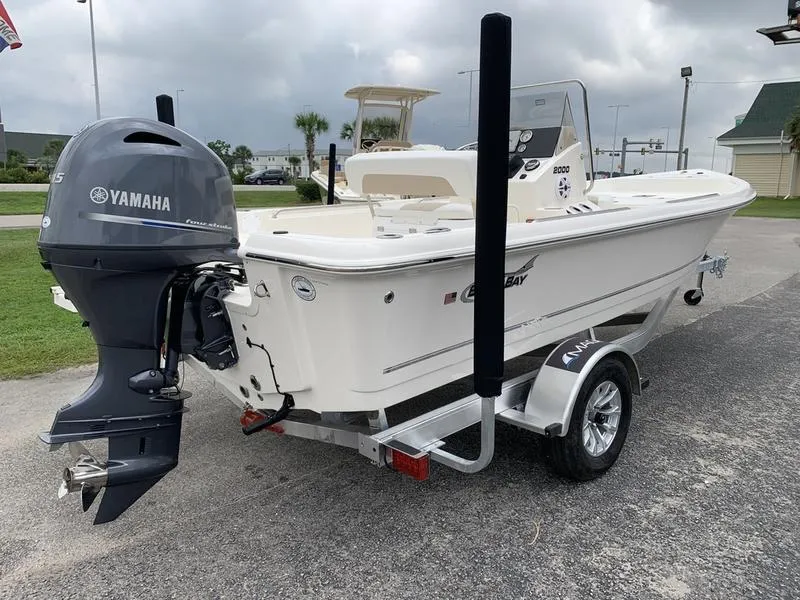 Slide: The Image of 2026 Bulls Bay 2000 boat with Yamaha 115 engine, parked outdoors. - 4