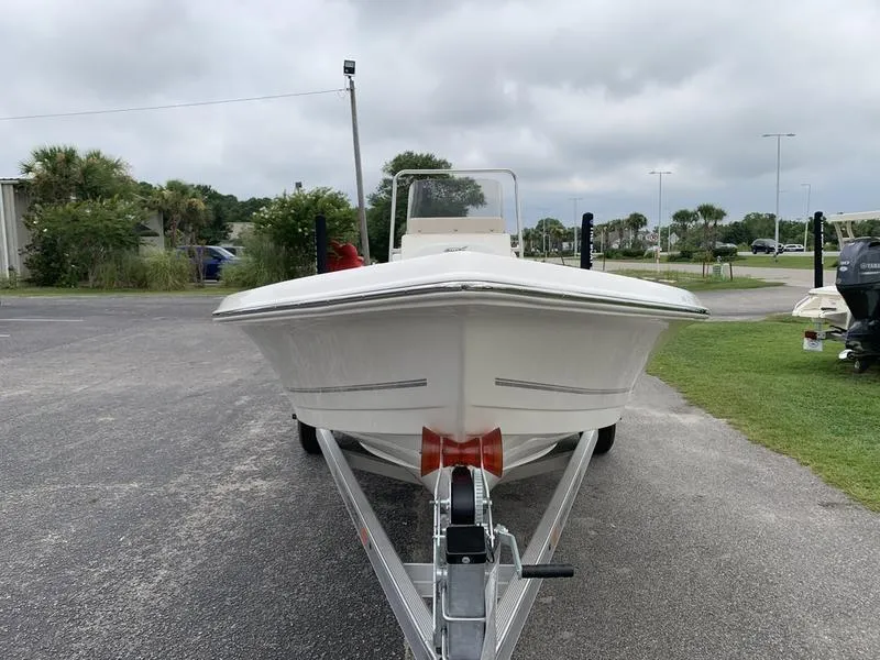 Slide: The Image of 2026 Bulls Bay 2000 boat on trailer, parked outdoors under cloudy sky. - 7
