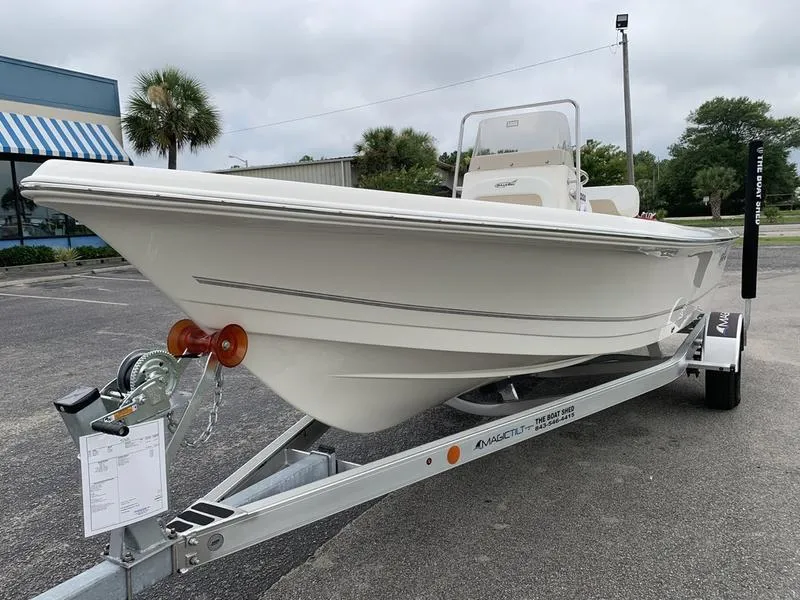 Slide: The Image of 2026 Bulls Bay 2000 boat on trailer, parked outdoors, overcast sky. - 8