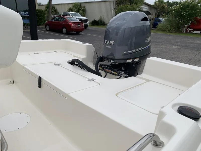 Slide: The Image of 2026 Bulls Bay 2000 boat on trailer, parked outdoors near a building. - 9