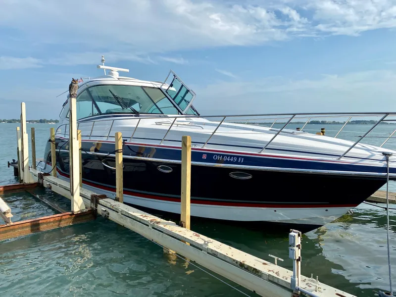Slide: The Image of 2014 Formula 45 Yacht docked on a sunny day, showcasing sleek design and luxury. - 11