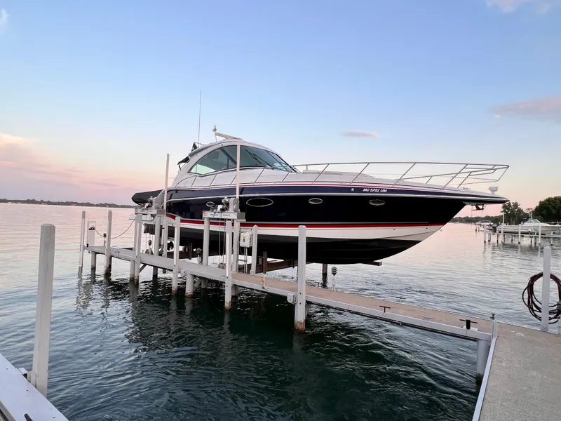Slide: The Image of 2014 Formula 45 Yacht on lift at sunset by the water. - 18