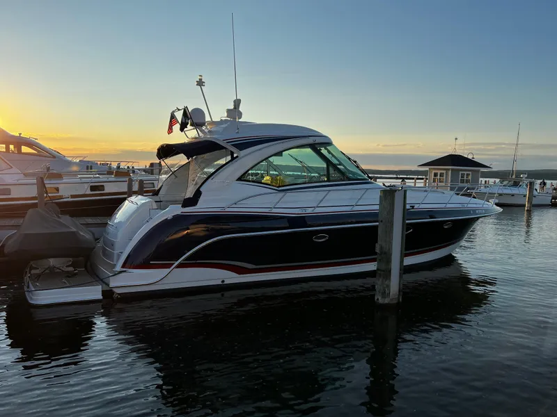 Slide: The Image of 2014 Formula 45 Yacht docked at sunset, reflecting on calm water. - 19