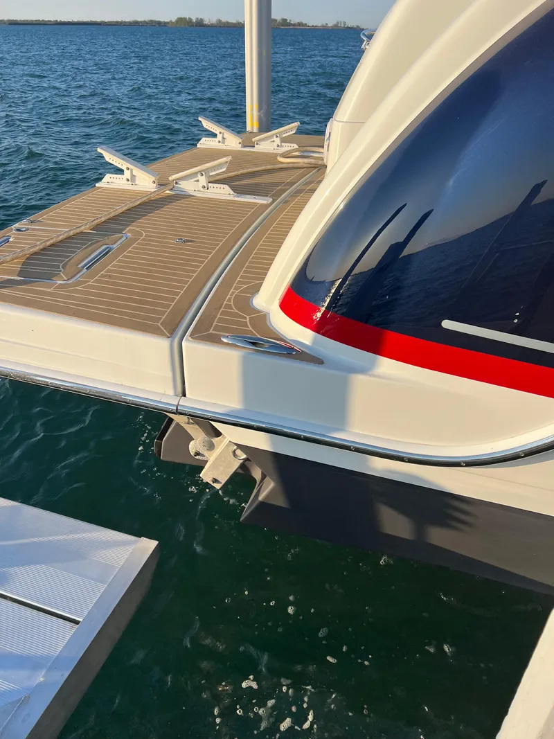 Slide: The Image of 2014 Formula 45 Yacht stern view with teak deck on water. - 21