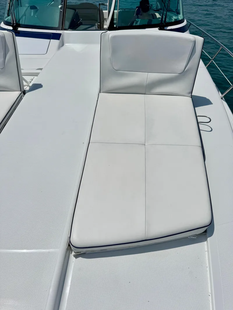 Slide: The Image of 2014 Formula 45 Yacht sun deck with white cushioned seating. - 25
