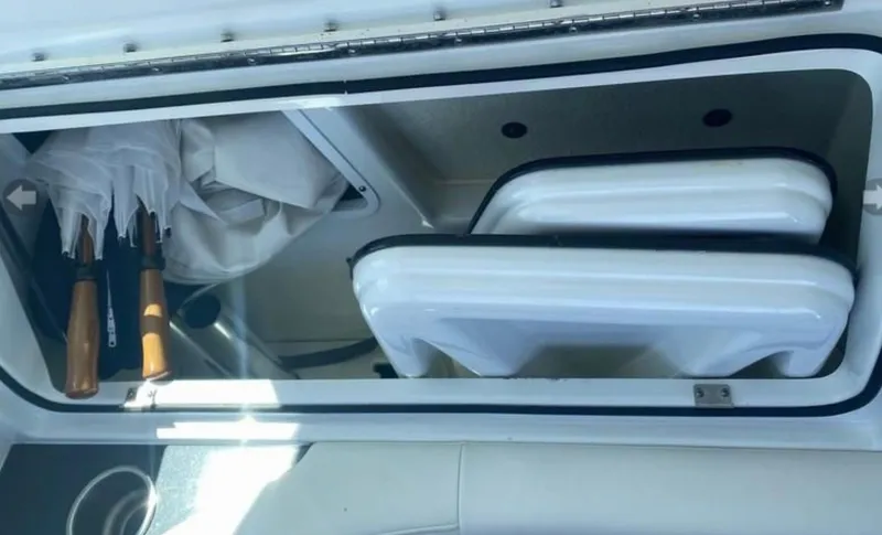 Slide: The Image of Storage compartment on a 2014 Formula 45 Yacht with umbrellas and life jackets. - 30