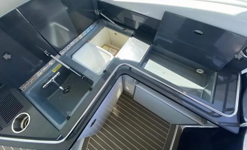 Slide: The Image of 2014 Formula 45 Yacht interior with sleek kitchen sink and storage compartments. - 33