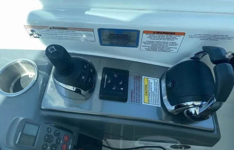 Slide: The Image of Control panel of a 2014 Formula 45 Yacht with joystick and throttle. - 36