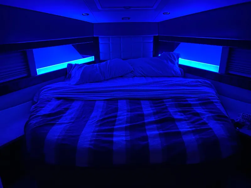 Slide: The Image of Luxurious bedroom with blue lighting on a 2014 Formula 45 Yacht. - 49