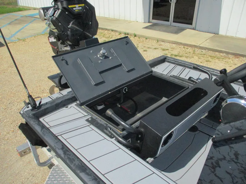 Slide: The Image of 2025 Gator Tail 2060 EXTREME boat with open storage compartment and visible engine. - 12