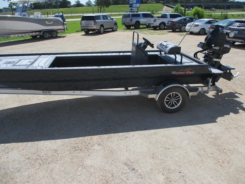 Slide: The Image of 2025 Gator Tail 2060 EXTREME boat on trailer in parking lot, side view. - 4