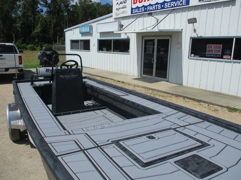 Slide: The Image of 2025 Gator Tail 2060 EXTREME boat at dealership, showcasing sleek design and spacious interior. - 5