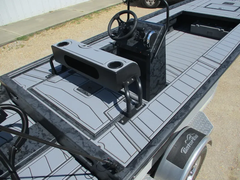 Slide: The Image of 2025 Gator Tail 2060 EXTREME boat interior with steering console and seating. - 8