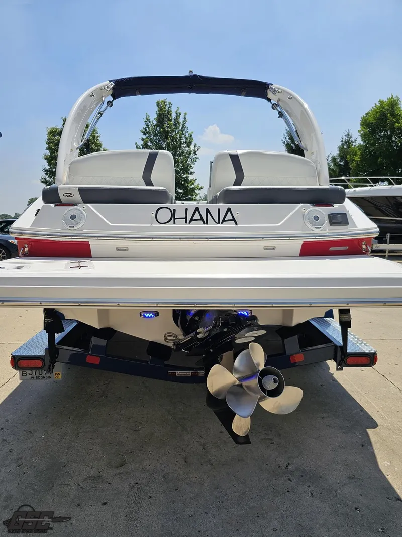 Slide: The Image of 2018 Regal 2300 Bowrider boat, rear view, on trailer, with "Ohana" name, sunny day. - 30